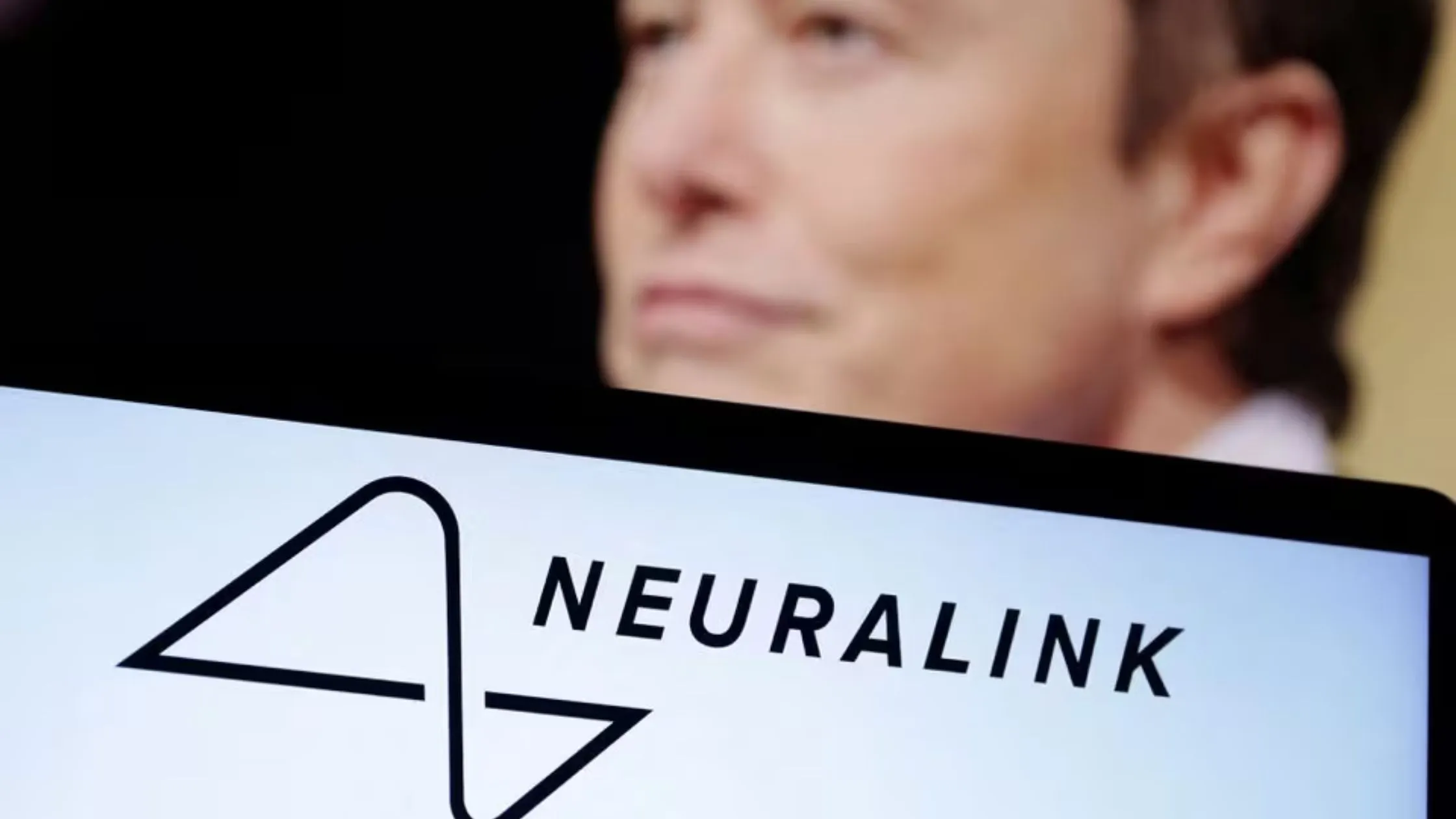 Neuralink logo and Elon Musk