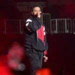 J. Cole performs onstage during Lil Baby & Friends Birthday Celebration